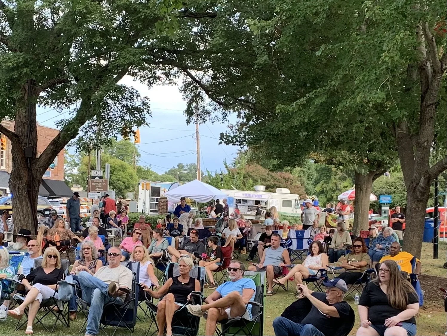 People gathered in Enfield watching a community event